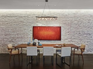 Revealing the Pros and Cons of Exposed Brick and How to Take Care of It - Photo 6 of 9 - An original brick wall in a former industrial space in Brooklyn is whitewashed for a sense of softness.