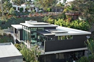 30 All-Black Exterior Modern Homes - Photo 10 of 30 - The Shayan House takes full advantage of its canyon site.