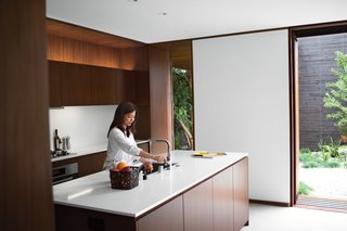 "I love the house more each day," says Tamami Sylvester of her and husband Michael's home by Sebastian Mariscal in Venice, California. The kitchen, which includes all Miele appliances, is sheathed in custom woodwork from Semihandmade. Accessories from A+R complement the Caesarstone countertops and Franke faucet. A LifeSource Water System provides filtration. Photo by Coral von Zumwalt.