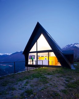 Updating the A-frame of yore, this home’s liberal use of windows makes the most of panoramic views spanning two valleys. Catalonia, Spain. Cadaval & Sola-Morales from the book Rock the Shack, Copyright Gestalten 2013.