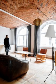 10 Charming Brick Interiors - Photo 10 of 10 - Much of the 1950s and '60s furniture collection comes from Denmark, the Czech Republic, Poland and the Netherlands.