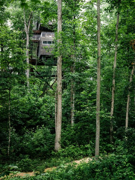 The Sustainability tree house is home base for the National Scout Jamboree, a weeklong event that's usually held every four years. The 2013 event was the first held at the new location in the Summit Bechtel Reserve. Seattle-based firm Mithun led the multidisciplinary team that worked on the project. BNIM is the architect of record, Nelson Byrd Woltz masterminded the landscaping, the structural engineering is by by Tipping Mar, and the exhibit design is by Volume, Inc. and Studio Terpeluk. Photo 2 of Sustainability Treehouse modern home