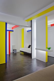 25 Bold Ways to Decorate with Yellow - Photo 17 of 25 - Taking cues from Piet Mondrian's iconic Broadway Boogie Woogie painting, architect and critic Joseph Giovannini recasts a New York City studio apartment.