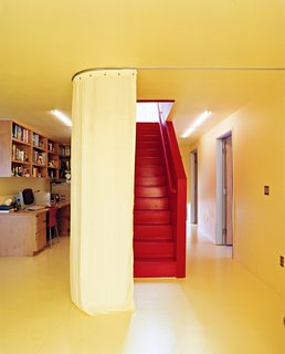 When residents want privacy (from the outside world or from other family members), sliding curtains, like this one dividing the office from the staircase, create temporary walls between rooms. "When you close the curtains, you can't see anything," says Wibowo. "It's more like Asian culture, where you don't want to show everything all at once. We want to be in control of what guests see."
