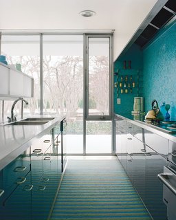How the Colors in Your Kitchen Affect Your Appetite - Photo 1 of 11 - A mosaic tile wall softens the laboratory-like effect of the glossy kitchen cabinets.