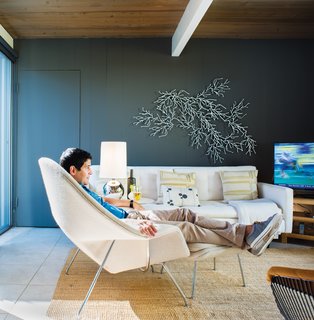 See for Yourself<br><br>After painting the sitting room room Kendall Charcoal from Benjamin Moore’s Aura line, Neely wanted a sculptural element that would show up against the dark hue. So he assembled his white Algues set, designed by the Bouroullec brothers for Vitra, on the wall behind the sofa with pillow by Judy Ross. "Though the Bouroullec piece is manufactured in mass quantities, you can create your own take on it," he says. "It looks great no matter how you place it. I think of it almost like an inkblot—the randomness is part of its beauty."