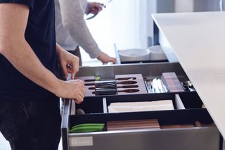 What Goes On Behind-the-Scenes at Henrybuilt’s Seattle Test Kitchen - Photo 5 of 8 - Their systems include award-winning components like the Drawer Accessory System, shown here with a construction of Paperstone and solid surface acrylic—both materials traditionally used in countertops. This addition extends high-performance function to the interior of a system, where users actually interact with it the most. As homeowners’ needs evolve, they can arrange the reconfigurable dividers in any way they desire. The pieces simply snap back together, thanks to a number of small magnets that are carefully embedded.