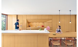 20 Best Modern Kitchen Counters - Photo 16 of 20 - For a Toronto couple with a love of minimalist Japanese architecture, a sleek, storage-packed kitchen was the first priority in their home's renovation. The white oak used for the cabinets, kitchen island, and dining table is finished with double-boiled linseed oil, which can be reapplied by the homeowners as the wood mellows and patinas. The white oak used for the cabinets, kitchen island, and dining table is finished with double-boiled linseed oil, which can be reapplied by the homeowners as the wood mellows and patinas.