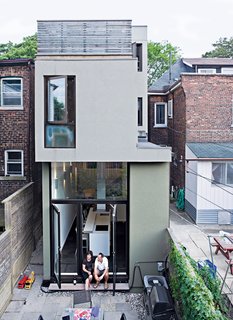 A rear view of the narrow house shows how Chong twisted the house’s volumes to bring daylight into each room.