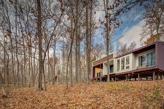 "The overall design is influenced by the use of traditional, locally available, and/or low-maintenance materials such as corrugated metal roofing, cement board lap-siding, heavy timber construction, and indigenous wood species," Brun says.