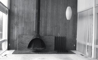 A Home's Past Mistakes Are Finally Corrected - Photo 3 of 14 - A George Nelson Cigar lamp and Malm fireplace were salvaged from the original living room.