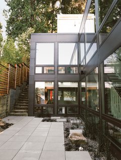 A Home's Past Mistakes Are Finally Corrected - Photo 13 of 14 - The owners added pavers and a rock garden to the exterior.
