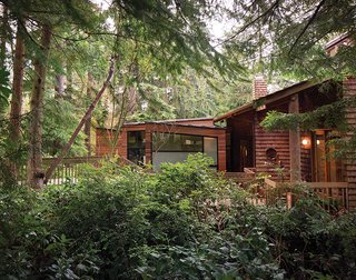 The addition’s beveled cedar siding will eventually weather to match the existing shakes, "but it’s different enough to distinguish the two," says Wibowo. "The window frames and metal roof color also match the dark bronze aluminum of the existing house, so it all blends."