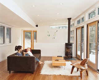 A Movie sofa, by CB2, and a Rais wood-burning stove are in the living room.