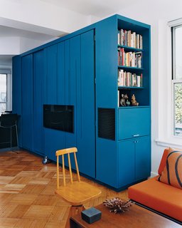 the blue-lacquered all-in-one cabinet in the fully closed position.