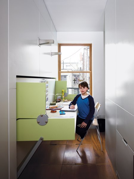 Having a home office in an apartment of this size might seem impossible, but flexible furniture transforms one room into two.