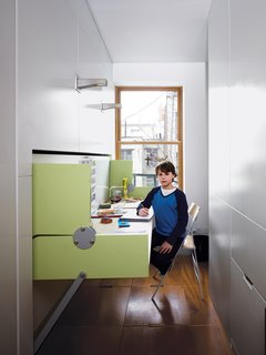 Having a home office in an apartment of this size might seem impossible, but flexible furniture transforms one room into two.