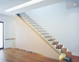 Briggs and Knowles’s elegant staircase draws upon the language of the oculus; the stairs are underlit with fluorescent lighting, which accents the line of the steps, giving them an ethereal, almost weightless quality.