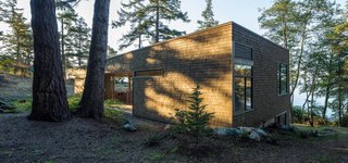 Our Daydream of Living on an Untouched Island Comes True in Washington - Photo 7 of 8 - "The liberal use of wood roots the structure in the landscape and provides the owners with an experience strongly connected with location," Herrin says. The exterior’s Western red cedar shingle siding has a semi-transparent stain, half Fieldstone and half Burnt Hickory from Cabot.