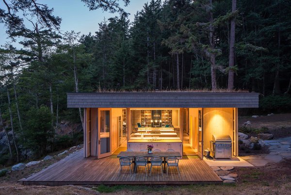 One of the main goals of the construction was to do as little harm as possible to the existing environment, which includes waterways that salmon depend upon. Herrin and his team created a garden roof that covers the full extent of the home to meet this objective. “This helps control storm water runoff and also replaces lost insect habitat—insects being a critical food source for juvenile salmon,” he says. Photo 8 of San Juan Islands Residence modern home
