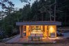 Modern home with Wood Patio, Porch, Deck, Large Patio, Porch, Deck, Exterior, Back Yard, House, Green Roof Material, and Wood Siding Material. One of the main goals of the construction was to do as little harm as possible to the existing environment, which includes waterways that salmon depend upon. Herrin and his team created a garden roof that covers the full extent of the home to meet this objective. “This helps control storm water runoff and also replaces lost insect habitat—insects being a critical food source for juvenile salmon,” he says. Photo 8 of San Juan Islands Residence