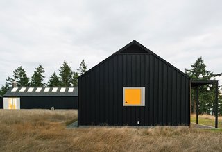 Architect Michelle Linden worked with Brothers to create a minimalist house. Inspired by the inward-looking approach of Cistercian abbeys, Linden oriented the U-shaped structure around a courtyard.