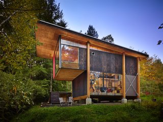 Anna Hoover, founder of the non-profit First Light Alaska, sought a "thought refuge, a room with a view to sit and contemplate future projects and reflect on recent travels and interactions, plenty of ‘headspace’—tall ceilings—and the ability to host other artists for studio time," she says. A longtime resident of the Pacific Northwest, Hoover was familiar with the work of Olson Kundig and contacted the Seattle-based firm to design her abode.