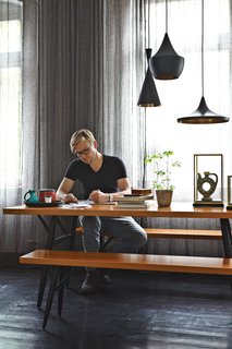 Sheer gray curtains by Ulf Moritz for Sahco add to the apartment’s moody atmosphere.