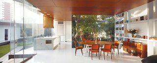 The dining area holds an adjunct kitchen designed for Lisette, a chef; the table base was repurposed from one from her former restaurant.