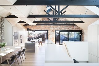 "A high-performance, heavily tinted glass was used within the skylights’ double-glazed units to reduce summer heat," Simpson says. Autex Industries provided the insulation for the year’s cooler months, and the addition of a second, more geometric ceiling hides modern-day electrical and mechanical cords.