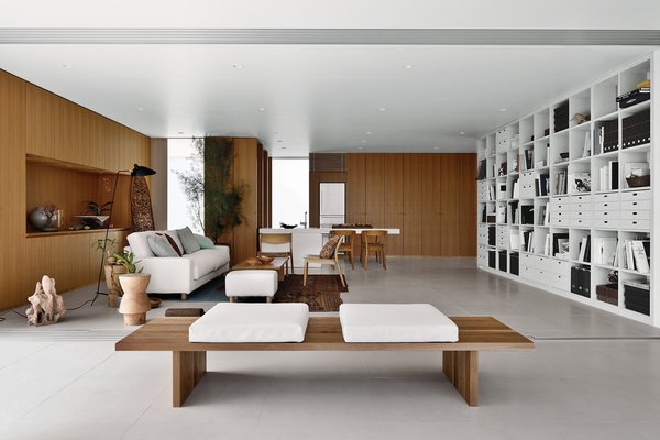 The interior is a spatially open layout with a flexible DIY storage system that supports the ceiling.