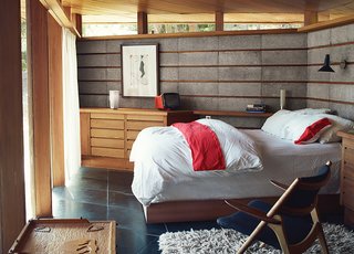 The Midcentury Home That Maintains Its Quirkiness After All These Years - Photo 7 of 9 - In the bedroom, a Margaret Kilgallen print joins a Brionvega Algol television, lamps from Patricia Urquiola and Pablo, and a Hans Wegner chair.