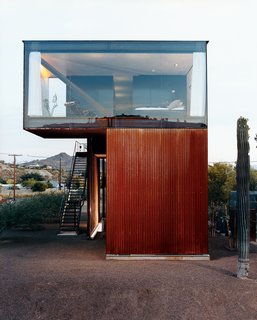 Xeros Effect - Photo 5 of 7 - The glass-enclosed master bedroom floats above the corrugated, oxidized steel exterior.