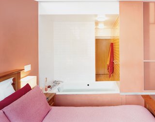 Harlem Renaissance - Photo 9 of 11 - Sliding panels open the hot tub to the master bedroom. The architects designed the <br><br>passive-solar house to collect heat in winter and screen it out in the hot months, and installed an energy-efficient radiant heating/cooling system in the floors.