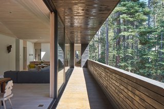 Here's What Norse Mythology and Modern Architecture Have in Common - Photo 5 of 7 - Beyond the open-air living and dining rooms, the master bedroom is also accessible by the shaded patio. The living room features a B&B Tufty-Too sectional sofa and two Bensen U-Turn chairs.