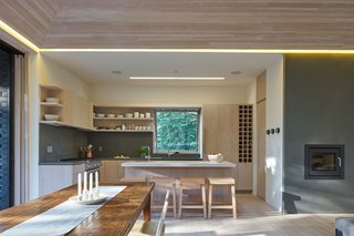 Here's What Norse Mythology and Modern Architecture Have in Common - Photo 4 of 7 - The open-plan kitchen serves the family’s needs for easy entertaining. The four bar stools are also custom designed by Lexie and were built by Yvonne Mouser.