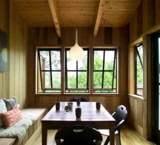 This dining nook is fully clad in Western cedar, augmenting the home's connection to the outdoors.