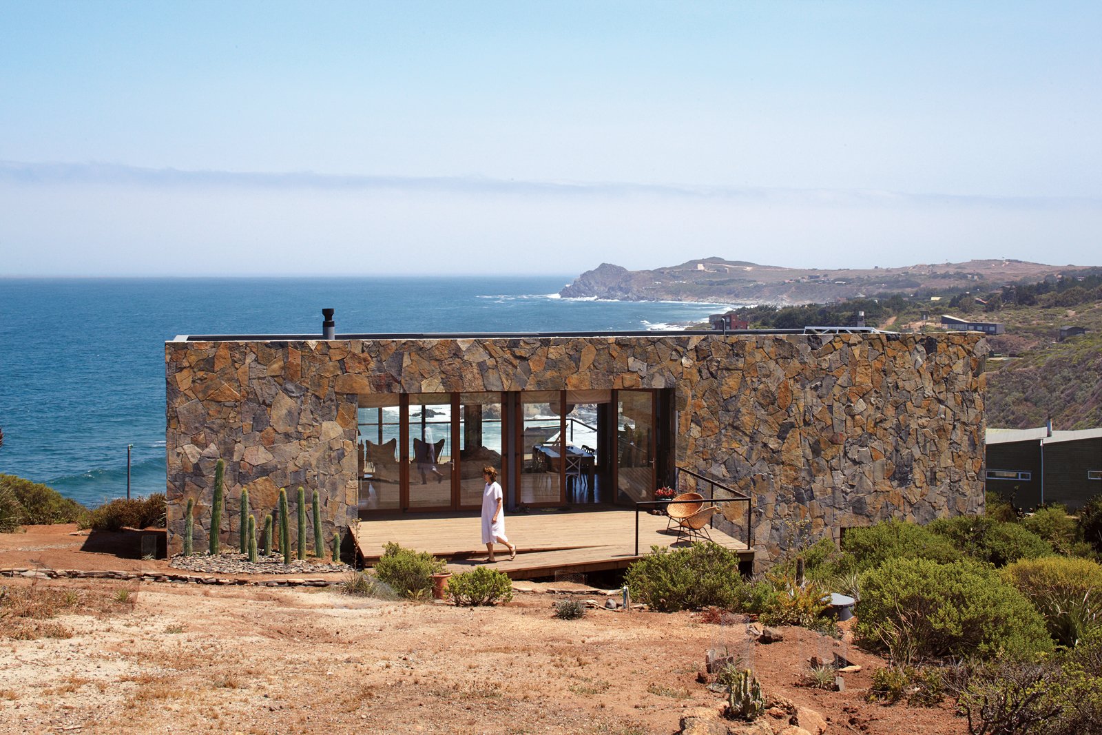 The Casa Cuatro sits above a 180-foot cliff that overlooks the Pacific Ocean. The locally quarried stone makes the house blend in with the landscape and acts as a thermal-mass wall, absorbing heat during the day and releasing it through the evening.