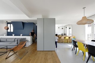 10 Modern Renovations to Unique Homes in France - Photo 7 of 10 - "The upper floor includes the entry, cloakroom, guest bathroom, kitchen, dining room, living room, and terrace," Hammer says. "In contrast to the lower floor and its separated rooms, the living area is composed as an open space with no walls." Nerd Chairs by David Geckeler for Muuto surround a handcrafted nutwood table in the dining room.