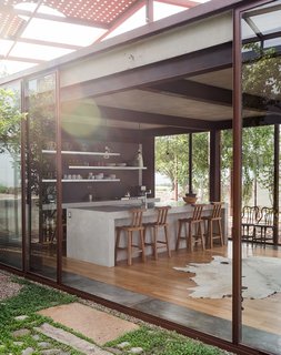 Lida and Austin share the main pavilion, where the kitchen, living area, and dining room are located.