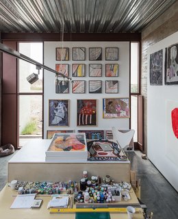 A workspace, bedroom, and bath comprise each of the two studios; an early riser, Lida spends most of the day painting in her space.