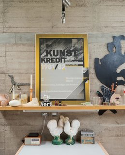 A collection of flea-market finds and personal keepsakes sit perched upon a shelf in Austin's studio.