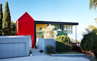 A Dream Home is an Architectural Self-Portrait - Photo 2 of 5 - A collage of brightly colored geometric volumes comprise the Ettore Sottsass–designed residence of Lesley Bailey and Adrian Olabuenaga, proprietors of jewelry and accessories company ACME Studio.