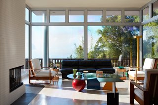 Thank Sottsass for the Most Memphis House Imaginable - Photo 3 of 14 - Sottsass specified nearly all of the interior details, down to the furnishings, including thevintage Hawaiian koa lounge chairs and Hyatt side tables of his own design, in the living room.