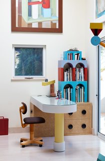 Thank Sottsass for the Most Memphis House Imaginable - Photo 6 of 14 - Giotto shelves, a Treetops floor lamp, and an Olivetti chair, all by Sottsass, furnish the home office. Adrian designed the desk, and the painting is by Nathalie Du Pasquier, one of the original Memphis designers.