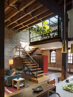 New York–based architect Andrew Franz undertook the renovation of an 1884 landmark in Tribeca that was formerly a soap warehouse designed by George W. DaCunha. Following a Romanesque Revival style, Franz reorganized and modernized the six-story building, which retains its original 16-foot beam ceilings, brick walls, timber columns, and elevator winches from the former freight shaft by incorporating steel, glass, handmade tile, and lacquer to complement the masonry and heavy timber. An interior courtyard and rectangular mezzanine are situated below the original 16-foot gull-wing ceiling planes.