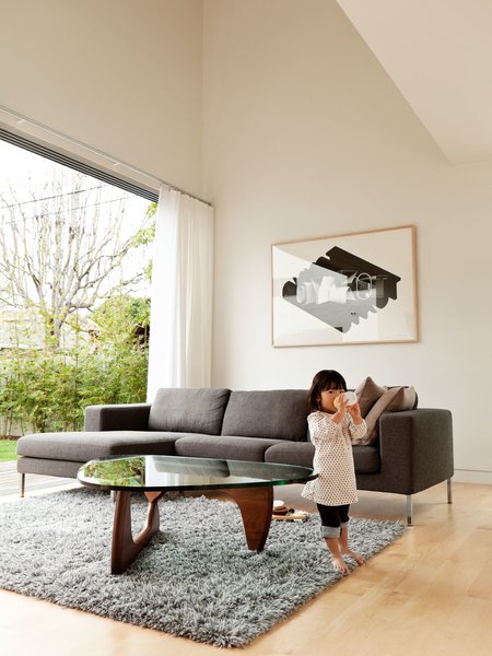 Design Dictionary: Noguchi Table - Photo 5 of 6 - In this L.A. home, the table is paired with a Stockholm Wool Rug from Ikea and the Neo Sectional Chaise Left by Niels Bendtsen from DWR.