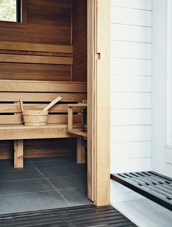 Torrified cedar lines the inside of the rooftop sauna.