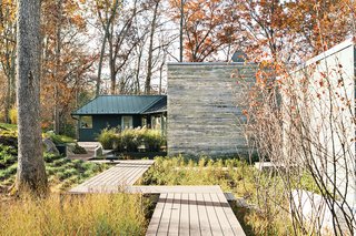 The landscape design, by Anna Boeschenstein of Grounded, followed a 2,200-square-foot extension by Formwork architects Robert and Cecilia H. Nichols. The front door is painted in Chinese Red by Sherwin-Williams.