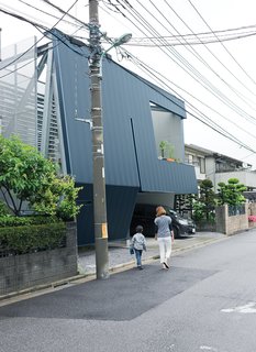 "Everyone stops to look at the building," says Motoshi. Neighbors may stare at the severe facade, but once inside they are amazed with the quality and comfort of his home. Its efficient design comes from IDEA Office’s clever rethink of local zoning regulations and required setbacks.